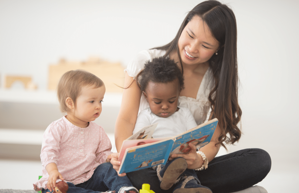 Nanny reading to babies
